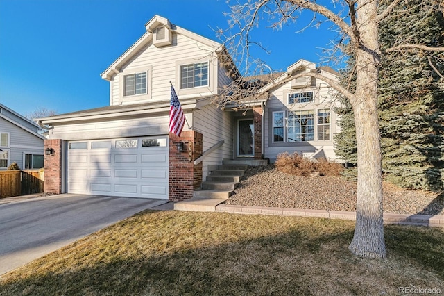 front facade featuring a garage and a front lawn