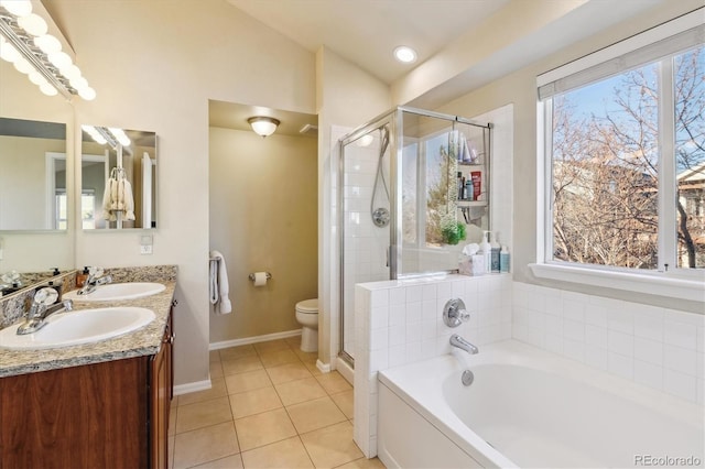 full bathroom featuring vanity, vaulted ceiling, tile patterned floors, independent shower and bath, and toilet