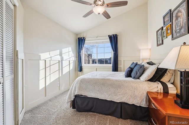 bedroom with lofted ceiling, ceiling fan, and carpet flooring