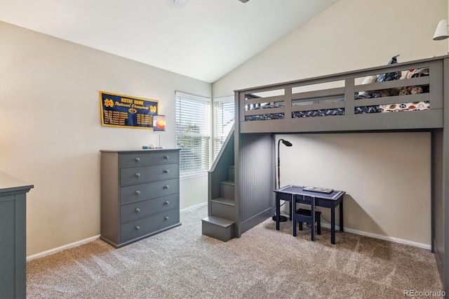 bedroom featuring vaulted ceiling and carpet floors