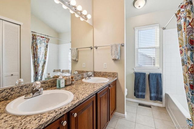 full bathroom featuring shower / tub combo with curtain, vanity, vaulted ceiling, tile patterned floors, and toilet