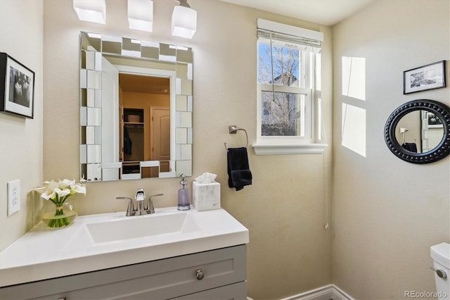 bathroom with vanity and toilet