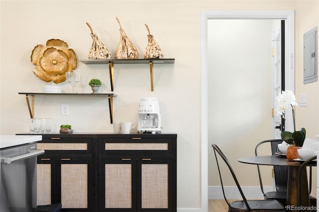 6512 Upham St, Arvada, CO 80003 - detailed view of electric panel, baseboards, and stainless steel dishwasher