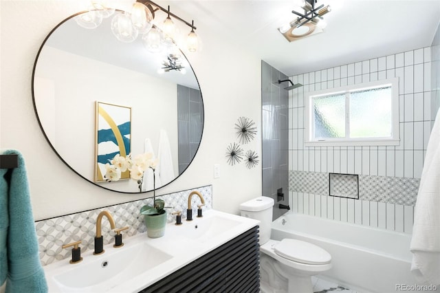 6512 Upham St, Arvada, CO 80003 - bathroom with a chandelier, backsplash, bathtub / shower combination, toilet, and double vanity