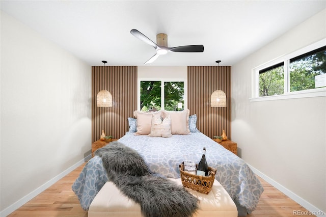 6512 Upham St, Arvada, CO 80003 - bedroom with wood finished floors, baseboards, and ceiling fan