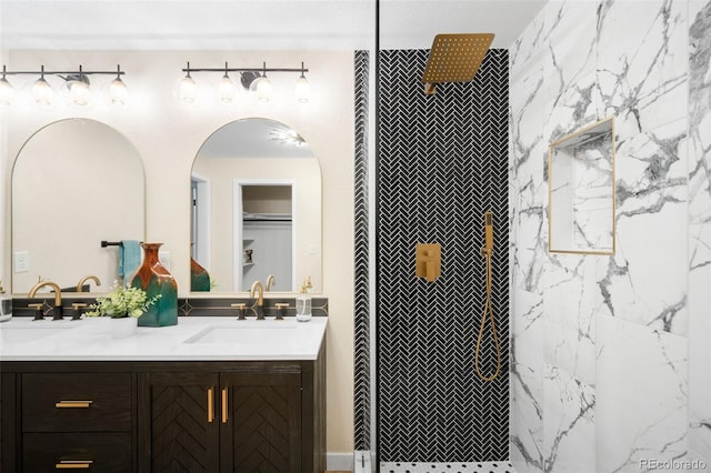 6512 Upham St, Arvada, CO 80003 - bathroom featuring double vanity and a tile shower