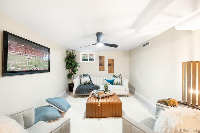 6512 Upham St, Arvada, CO 80003 - living area featuring a ceiling fan, baseboards, and carpet
