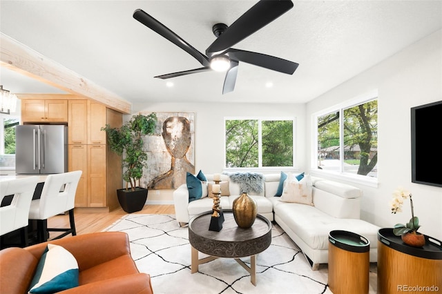 6512 Upham St, Arvada, CO 80003 - living room with plenty of natural light, a ceiling fan, light wood finished floors, and recessed lighting