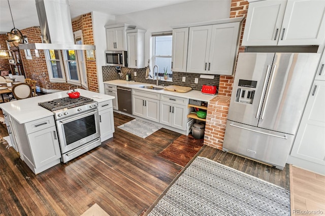 kitchen featuring white cabinets, stainless steel appliances, tasteful backsplash, and sink