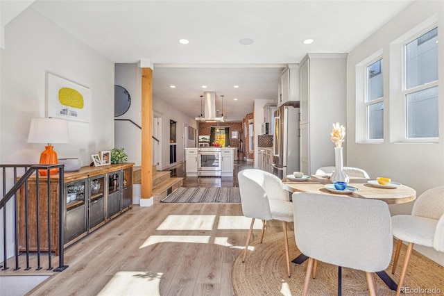 dining area with light hardwood / wood-style floors