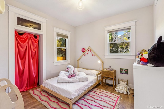 bedroom with hardwood / wood-style flooring