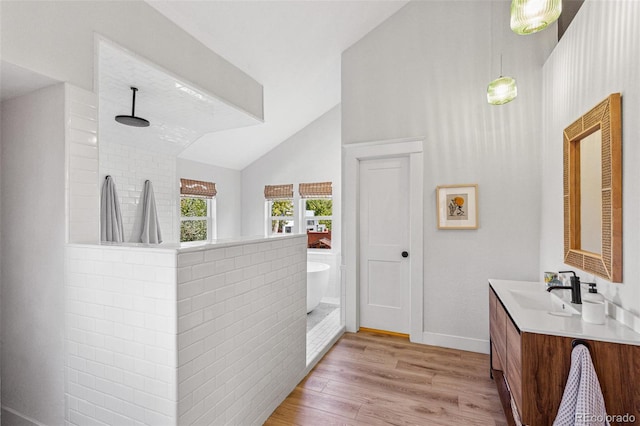 bathroom featuring separate shower and tub, vanity, vaulted ceiling, and hardwood / wood-style flooring