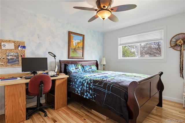 bedroom featuring baseboards, a ceiling fan, wallpapered walls, and wood finished floors