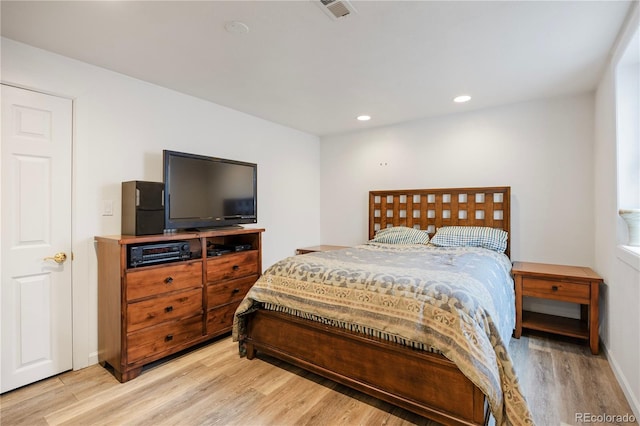 bedroom featuring recessed lighting, visible vents, and light wood-type flooring