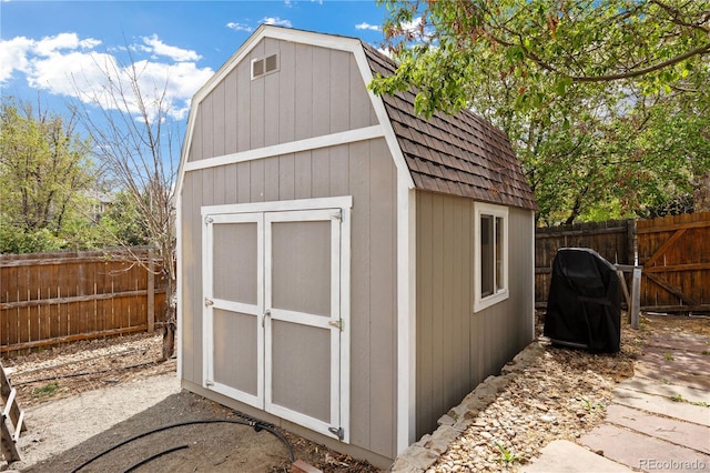 view of shed featuring a fenced backyard