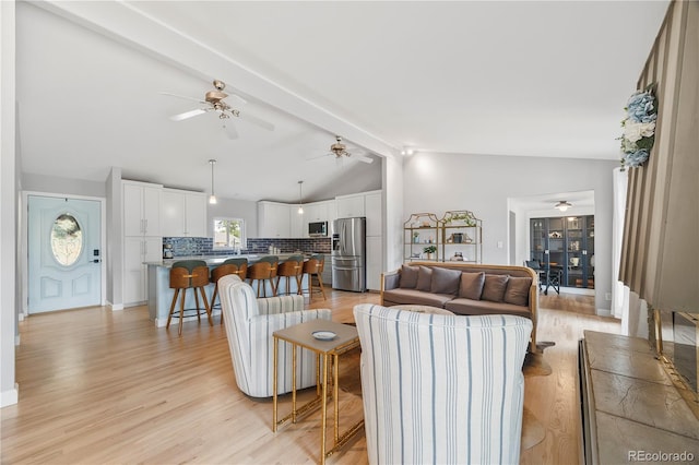 7767 S Depew St, Littleton, CO 80128 - living room featuring ceiling fan and light wood finished floors