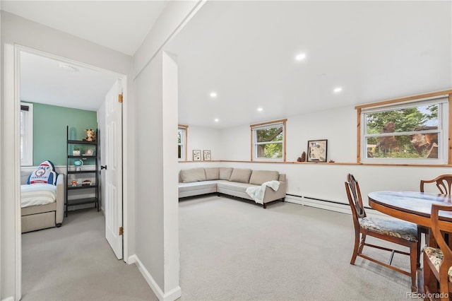 7767 S Depew St, Littleton, CO 80128 - carpeted living room with plenty of natural light, recessed lighting, and a baseboard heating unit