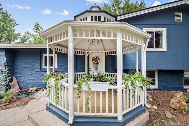 7767 S Depew St, Littleton, CO 80128 - view of front of home featuring a porch and stone siding