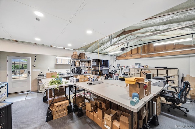 7767 S Depew St, Littleton, CO 80128 - garage featuring recessed lighting, a workshop area, and a garage door opener