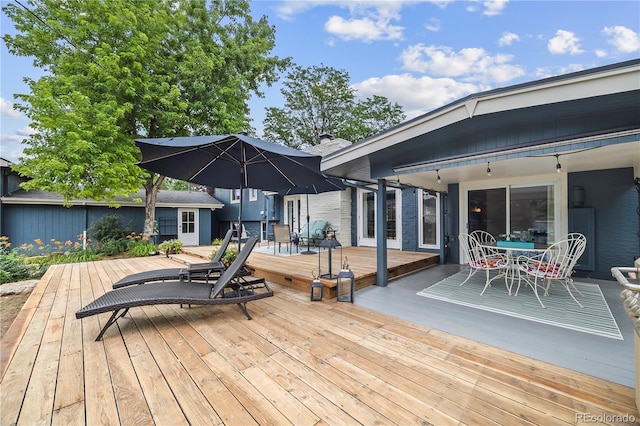7767 S Depew St, Littleton, CO 80128 - wooden deck with outdoor dining area