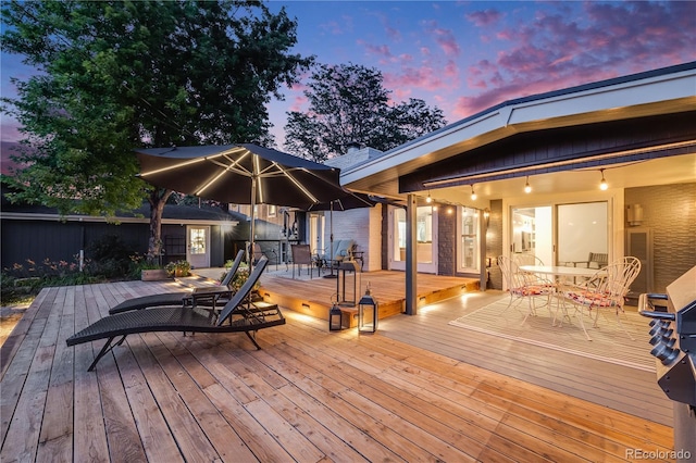 7767 S Depew St, Littleton, CO 80128 - deck at dusk featuring outdoor dining area