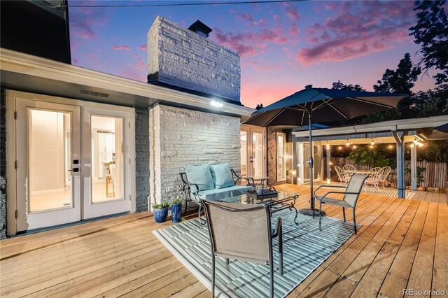 7767 S Depew St, Littleton, CO 80128 - wooden terrace featuring outdoor lounge area and french doors