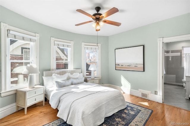 bedroom featuring visible vents, a ceiling fan, light wood-type flooring, and baseboards