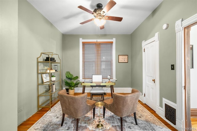 office featuring visible vents, ceiling fan, and wood finished floors