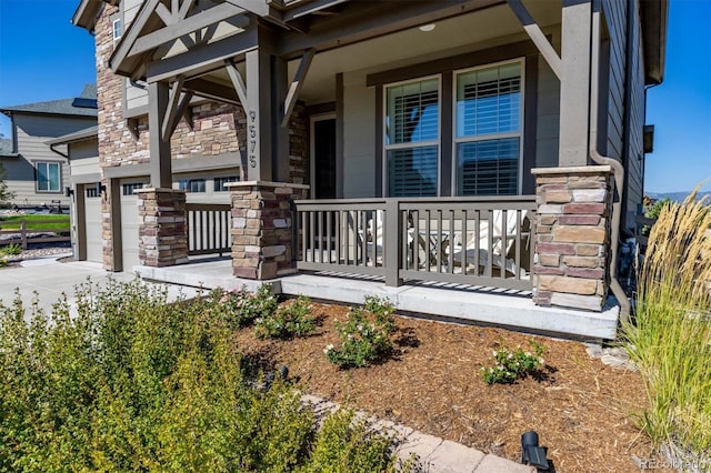 exterior space featuring a garage and a porch