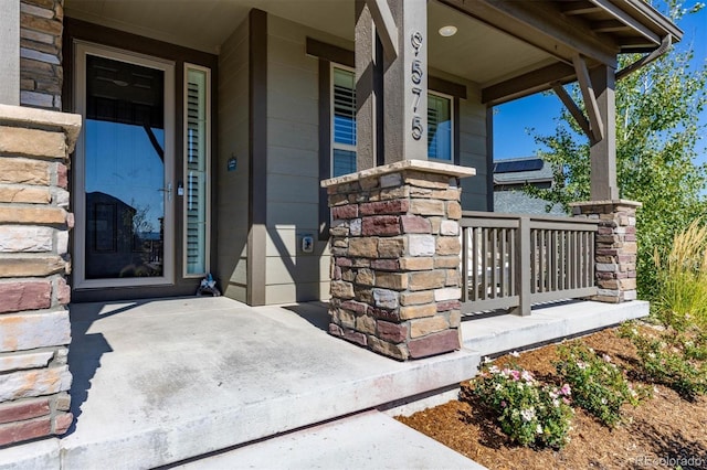 property entrance with covered porch