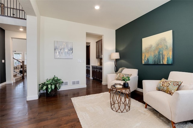 living area with dark hardwood / wood-style flooring