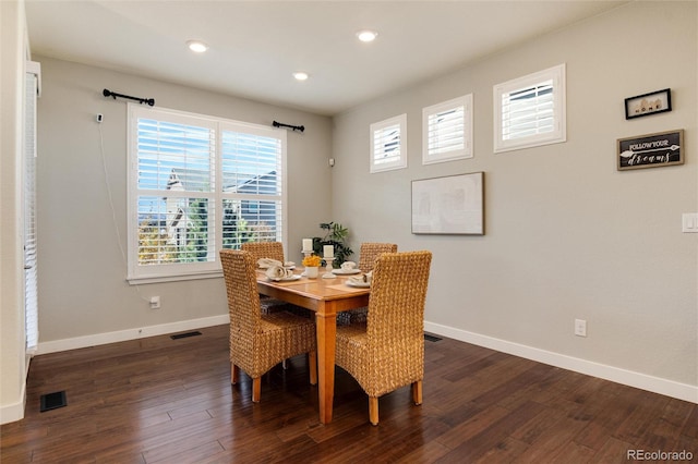 dining space with dark wood-type flooring