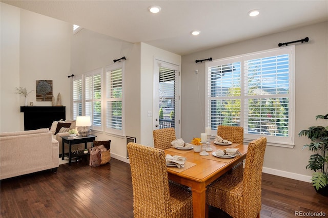 dining space with dark hardwood / wood-style flooring