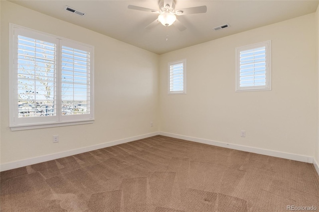 empty room featuring carpet and ceiling fan