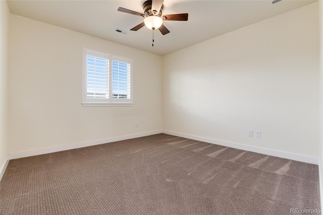 spare room with carpet flooring and ceiling fan