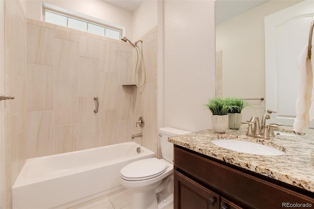 full bathroom featuring tile patterned flooring, vanity, toilet, and tiled shower / bath