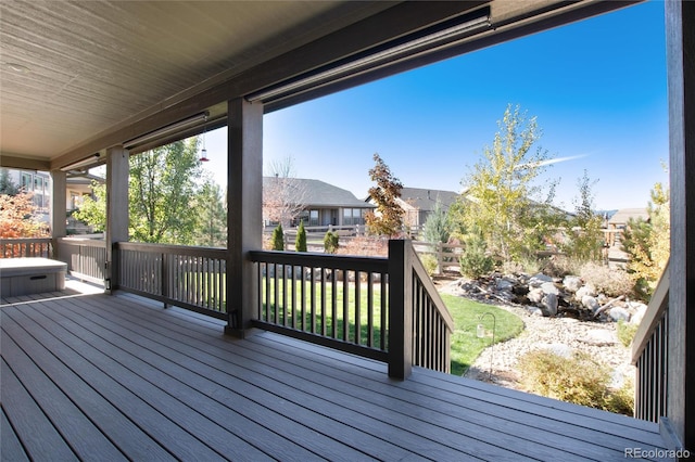 wooden deck with a lawn