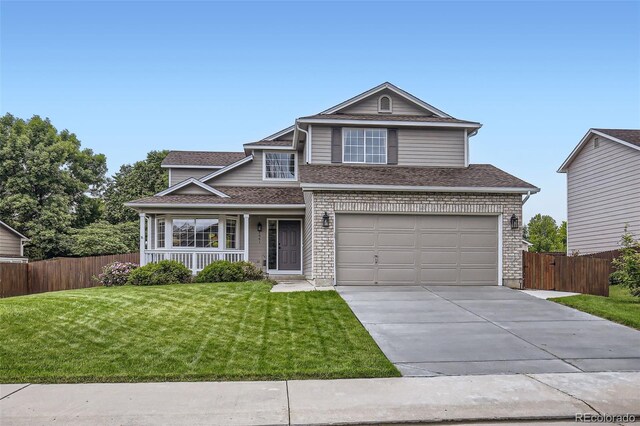 1641 Cedarwood Dr, Longmont, CO 80504 - traditional-style home featuring driveway, a garage, covered porch, and roof with shingles