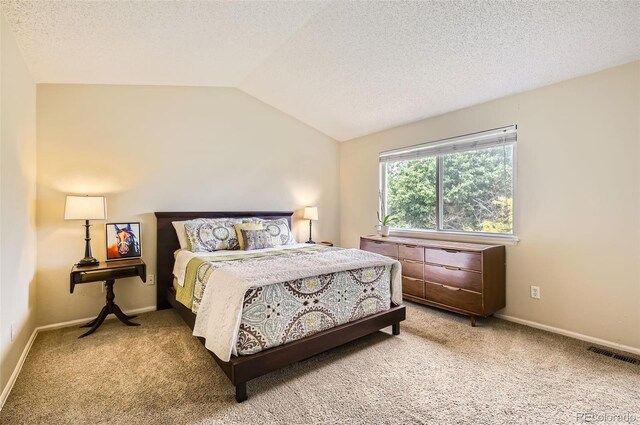 1641 Cedarwood Dr, Longmont, CO 80504 - bedroom featuring light carpet, lofted ceiling, a textured ceiling, and baseboards