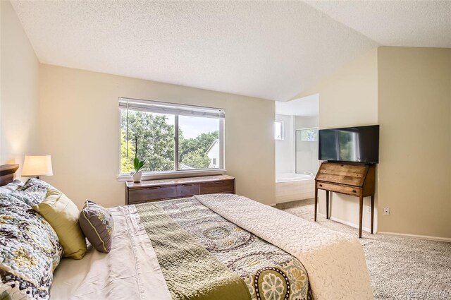 1641 Cedarwood Dr, Longmont, CO 80504 - bedroom featuring vaulted ceiling, a textured ceiling, and carpet flooring