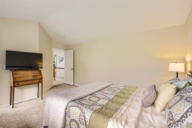 1641 Cedarwood Dr, Longmont, CO 80504 - carpeted bedroom with vaulted ceiling and baseboards
