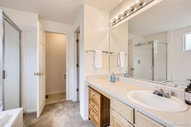 1641 Cedarwood Dr, Longmont, CO 80504 - full bath featuring vanity, a shower stall, a garden tub, and baseboards