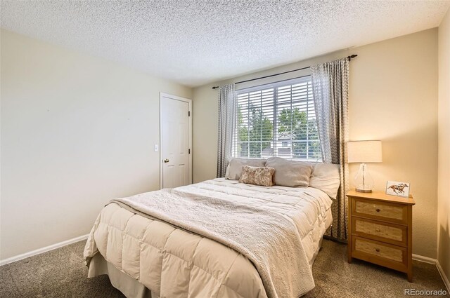 1641 Cedarwood Dr, Longmont, CO 80504 - carpeted bedroom featuring baseboards and a textured ceiling