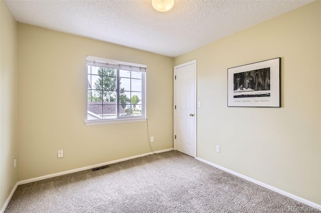 1641 Cedarwood Dr, Longmont, CO 80504 - carpeted spare room featuring a textured ceiling and baseboards