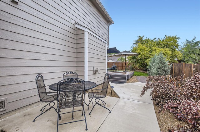1641 Cedarwood Dr, Longmont, CO 80504 - view of patio featuring outdoor dining area