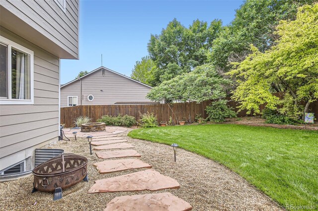 1641 Cedarwood Dr, Longmont, CO 80504 - view of yard featuring a fire pit