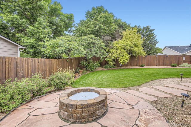 1641 Cedarwood Dr, Longmont, CO 80504 - view of patio featuring an outdoor fire pit
