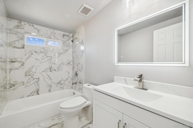 full bathroom with tiled shower / bath combo, toilet, and vanity