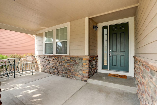 property entrance featuring covered porch