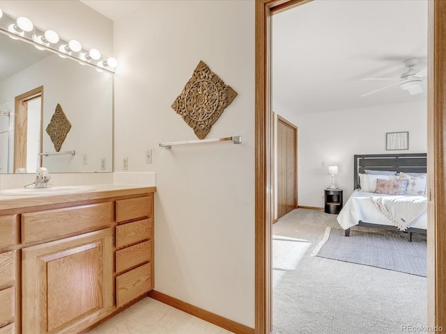 bathroom featuring ceiling fan and vanity